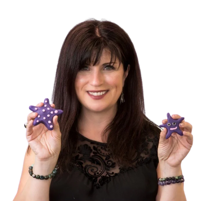 Image of a woman with long brown hair in a black top holding starfish make of purple playdoh